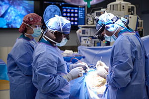 A photo of Cincinnati Children's neurosurgeons in the operating room.